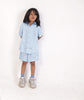 Hand-embroidered detail on the pale blue cloth of the Pale Sky Co-ord