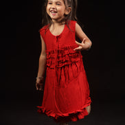 Close view of the gathered ruffle tiers and self-tie neck cord on Primrose, Zouhi Edition Two
