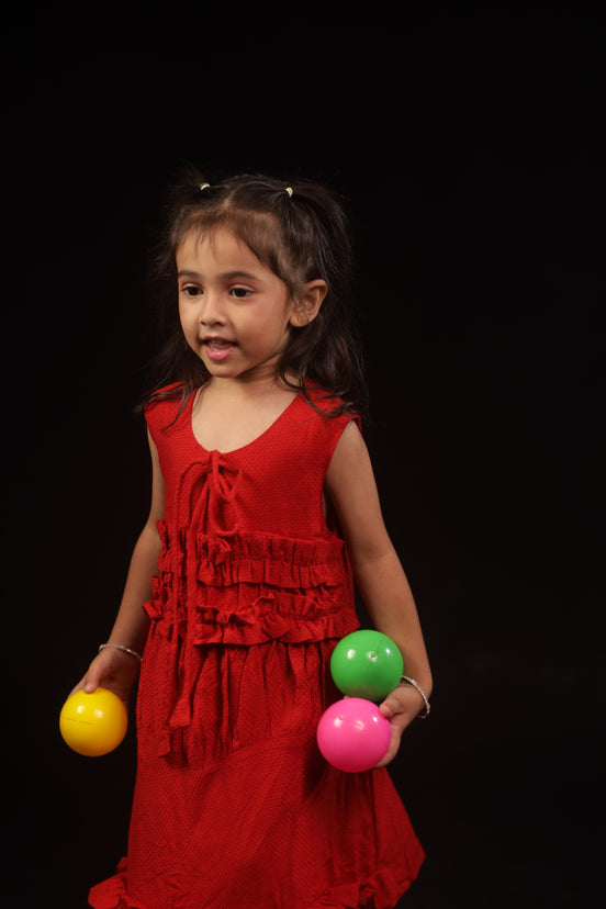 Full front view of Primrose · Edition Two, a sleeveless scarlet kids frock in plant-based eucalyptus fibre, sizes 1 to 12 years