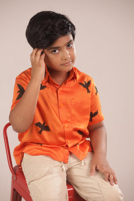 The Sunrise Bird Shirt worn seated, showing how the sugar cane fibre falls
